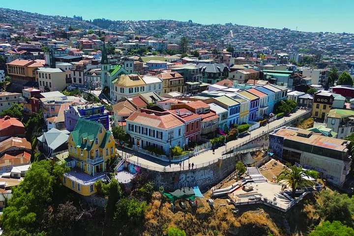 Aerial view of a hilltop promenade lined with pastel houses in Valparaíso