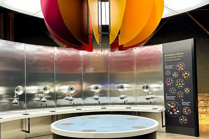 Aroma station with steel funnels under large coloured petal sculptures