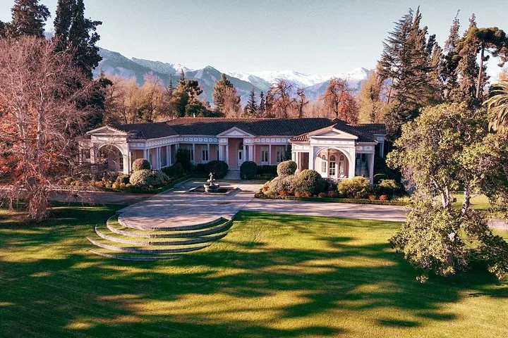 Casa Don Melchor manor and lawns below the snow-capped Andes
