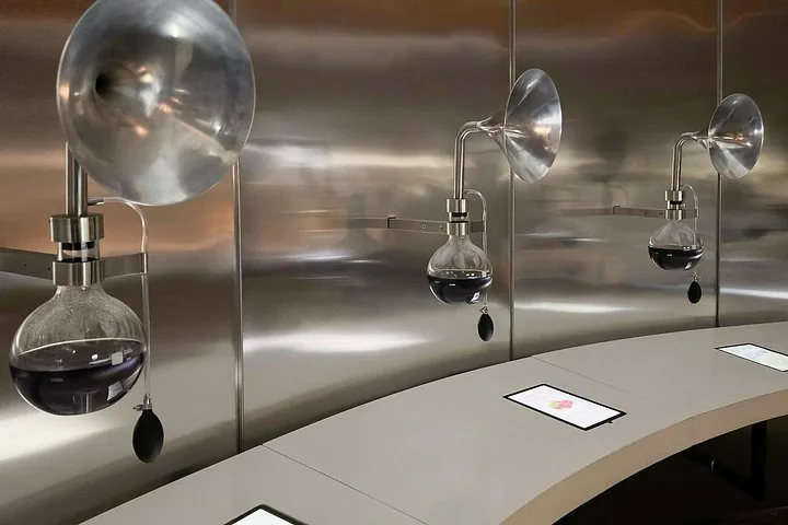 Glass aroma flasks and steel funnels in the sensory exhibit